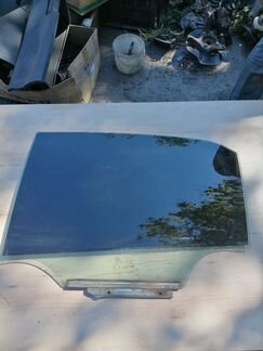 Стекло заднее левое Toyota Corolla E150